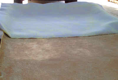 applying the headliner material to the headliner board of the Jeep Cherokee putting the new headliner material on the headliner board of the jeep cherokee sport