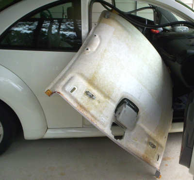 Taking the headliner board out of the 1999 Volkswagon Beetle take the headliner board out of the VW Beetle